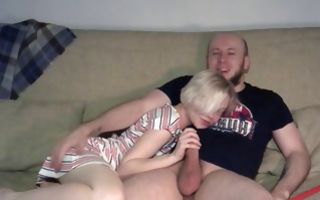 Short haired blonde gives him a hand job and gets fucked on the sofa